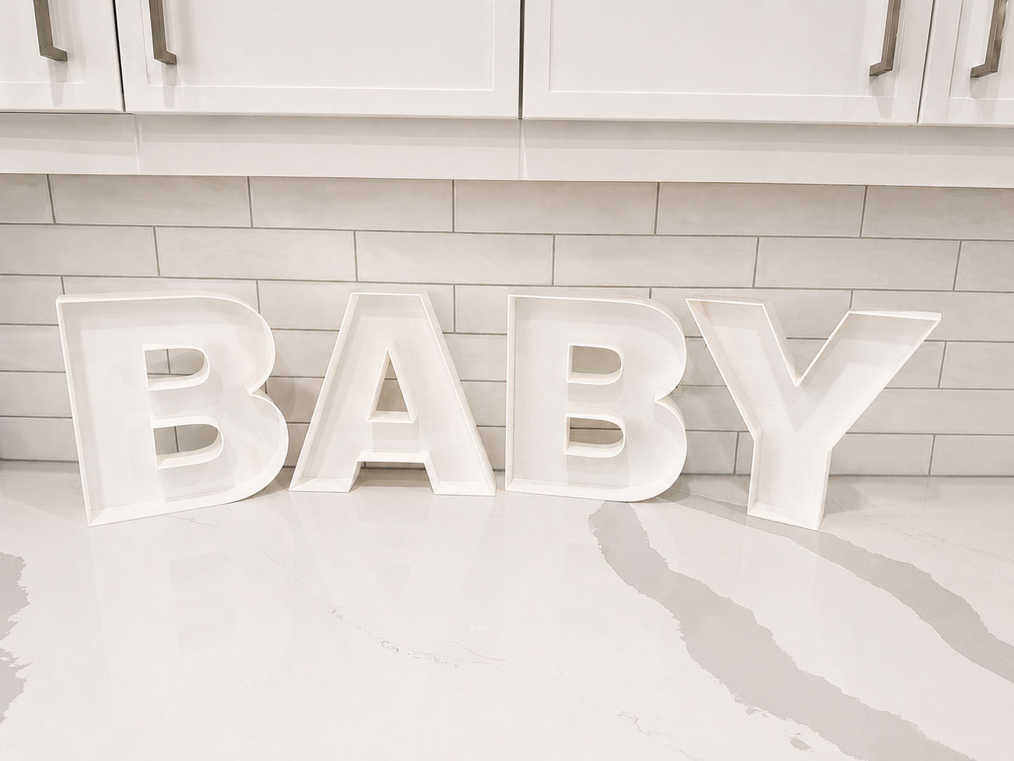 White Plastic Large “BABY” Letters